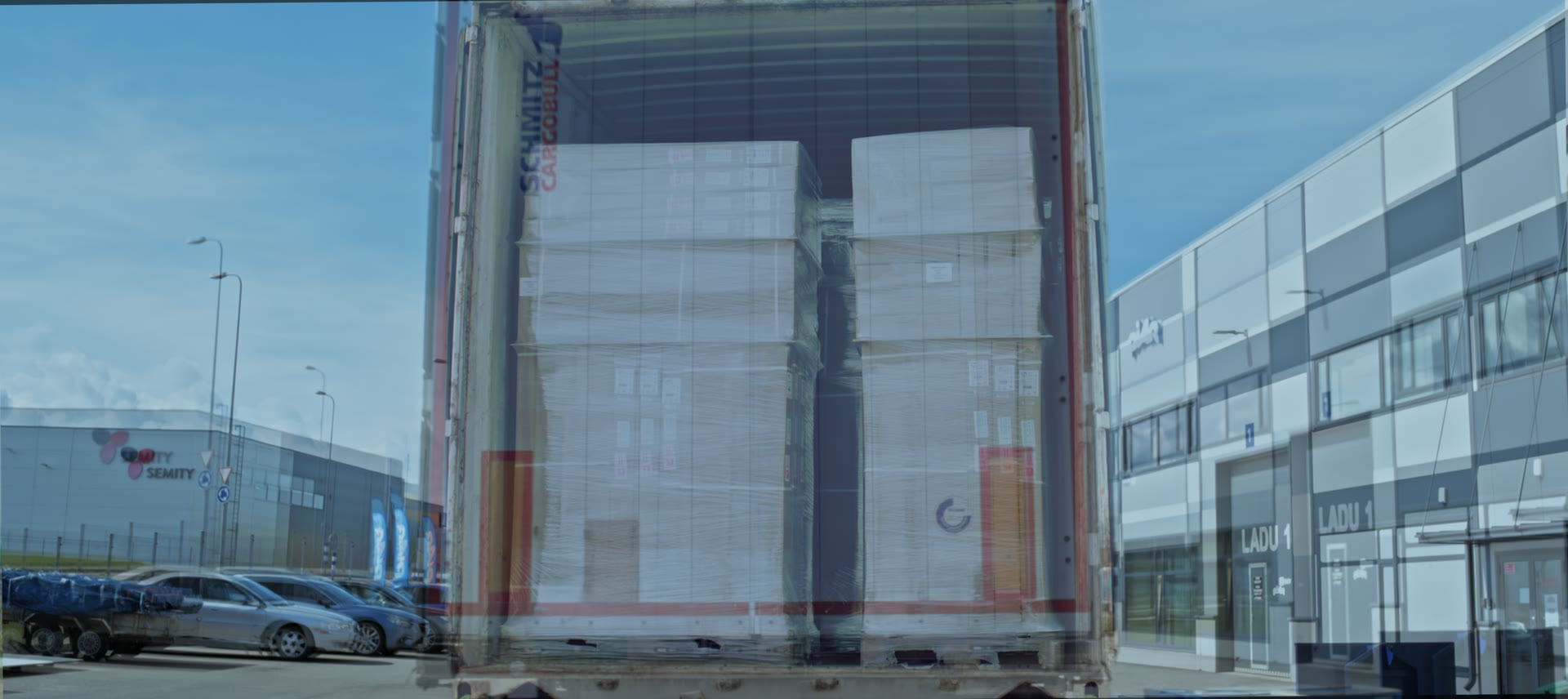 A truck trailer backed up to the Piar warehouse loading door.